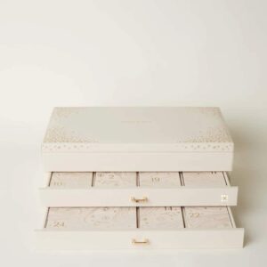 Astrid Miyu advent calendar includes 24 exquisite jewellery pieces in gold or silver, presented in an elegant faux leather beige box with a mirror