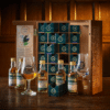 A Whisky Tour of Scotland 2023 advent calendar contains 24 50ml bottles of unique Scotch whiskies presented in a wooden handmade and engraved rectangular cabinet