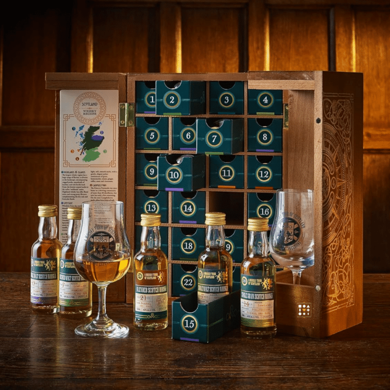 A Whisky Tour of Scotland 2023 advent calendar contains 24 50ml bottles of unique Scotch whiskies presented in a wooden handmade and engraved rectangular cabinet