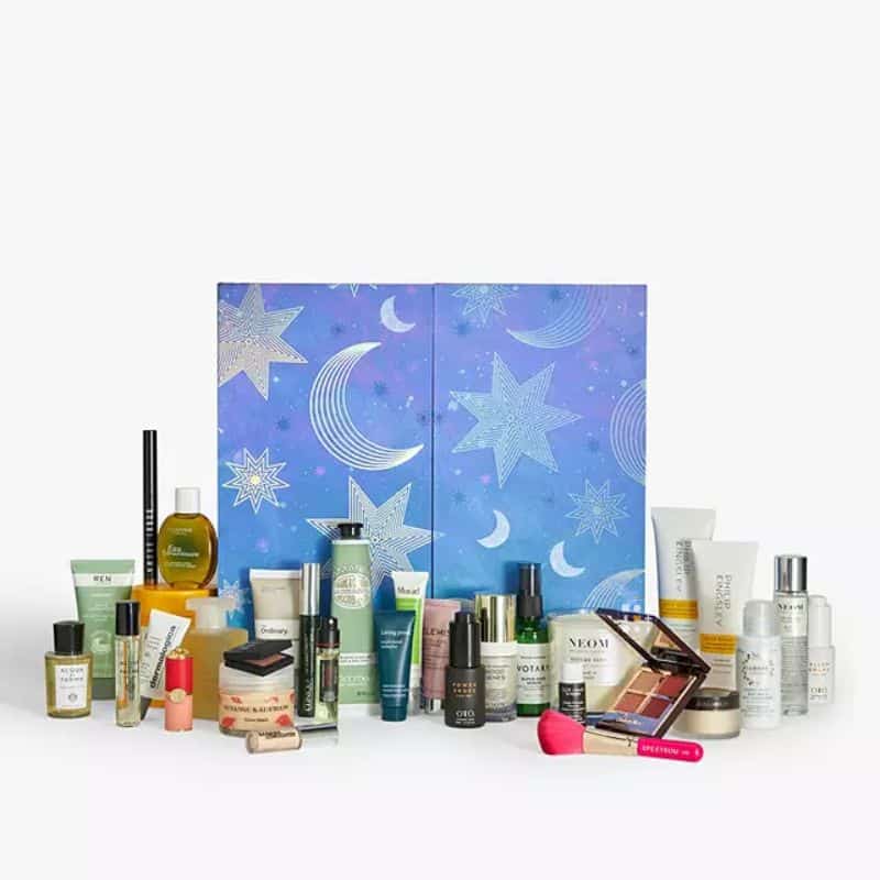 John Lewis advent calendar 2023 - includes 31 full and deluxe-size beauty products packaged in a beautiful navy blue box with moon and star imprints