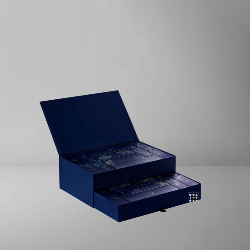 Boots Premium Advent Calendar 2023 presented in a sleek navy blue squared box with a golden wreath