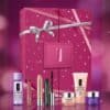 Clinique Advent Calendar 2026 skincare and makeup advent calendar with seven hero products styled on a magenta background