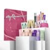 Clinique advent calendar for women with products arranged on white podiums beside the pink gift box