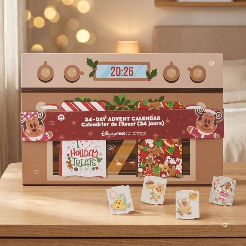 Disney Mystery Pin Advent Calendar 2026 oven box styled in a festive setting with four enamel pins