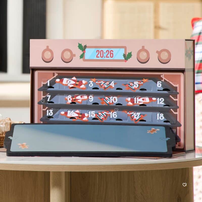 Disney Mystery Pin Advent Calendar 2026 opened, showing the numbered doors inside the oven case
