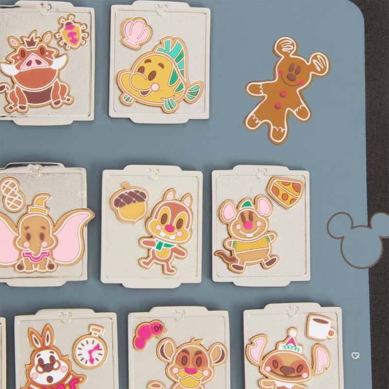 Close-up of cloisonne enamel pins from the Disney Pin Advent Calendar 2026, styled as iced Christmas biscuits