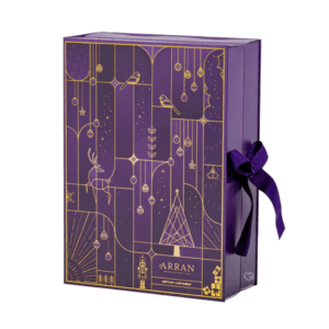 Arran Advent Calendar 2025 in festive red design with 25 luxury beauty treats and two exclusive seasonal scents.