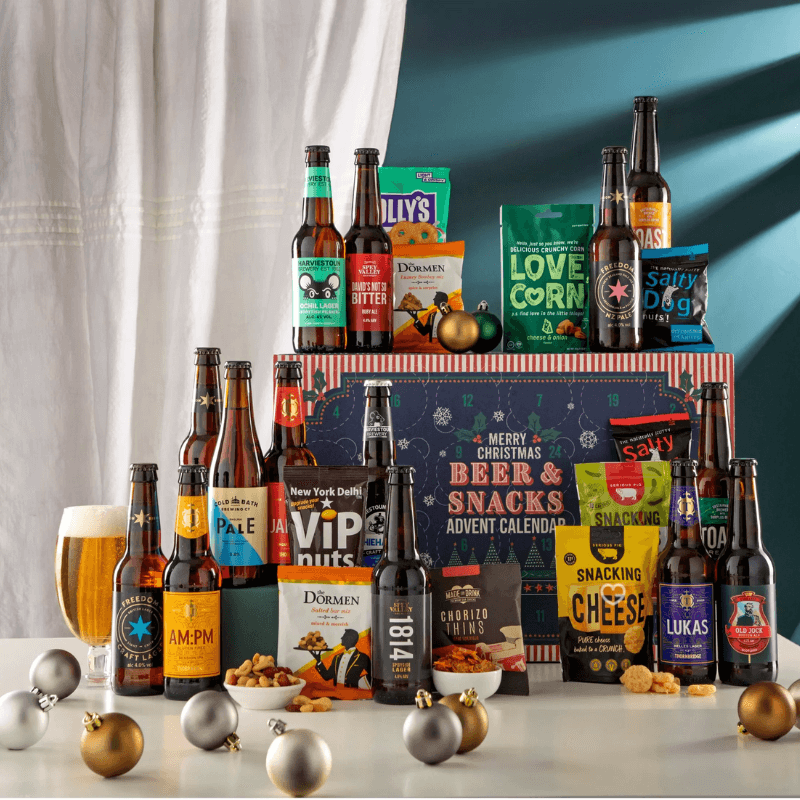 John Lewis Beer & Snack Advent Calendar 2025 with 24 craft beers and gourmet snacks in festive packaging, perfect for adult beer lovers.