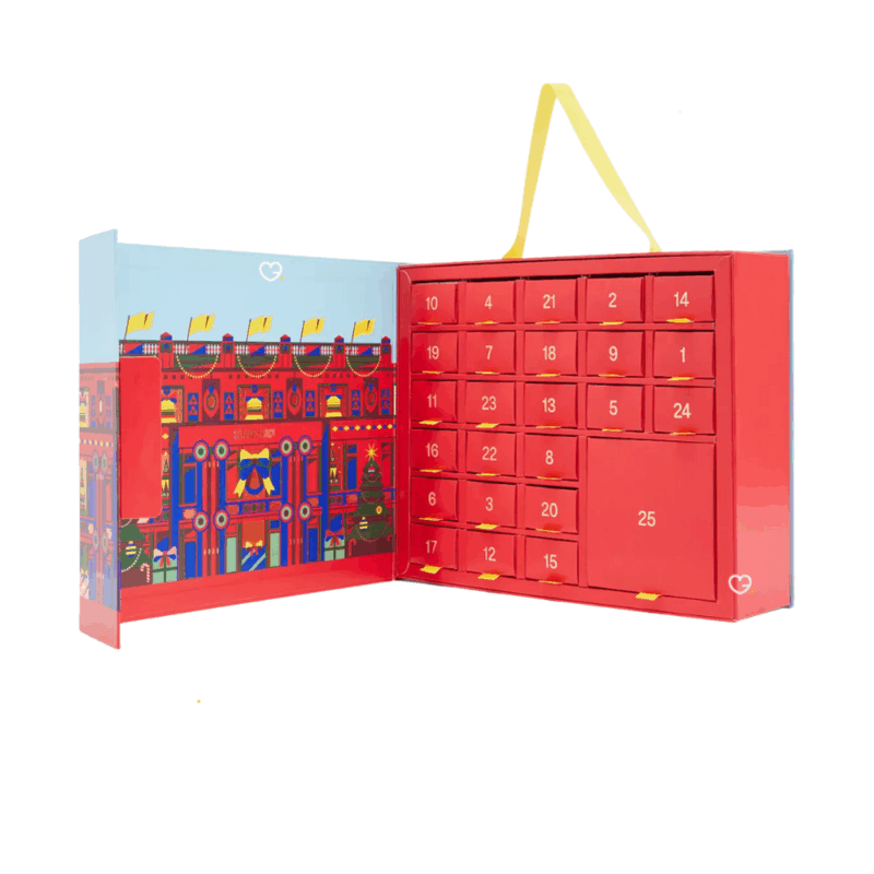 Selfridges Mini Mince Pie Advent Calendar 2025 contains 420g of festive mini mince pies, in a beautifully illustrated festive box, with a handy yellow ribbon for easy carrying