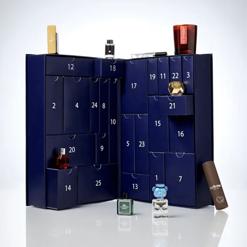 The Fragrance Shop Advent Calendar 2025 in festive blue box with 25 luxury mini perfumes and a gift voucher.