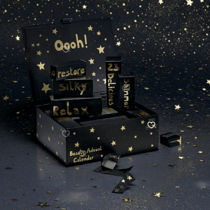 Marks & Spencer Advent Calendar 2025 contains 25 beauty products and is presented in a black box illustrated by Bella Freud.