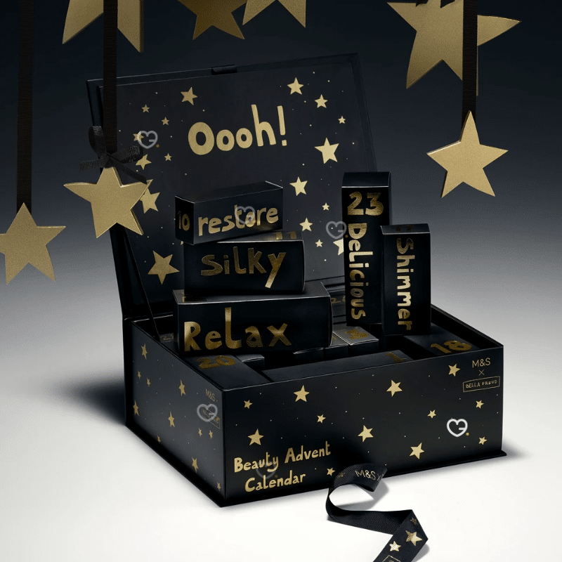 Marks & Spencer Advent Calendar 2025 contains 25 beauty products and is presented in a black box illustrated by Bella Freud.