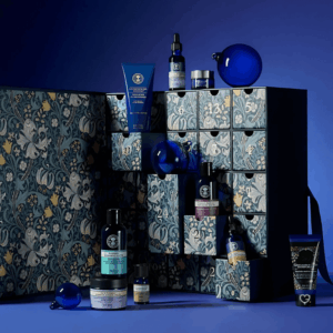 Neal's Yard Remedies Advent Calendar 2025 in blue festive box with 24 organic beauty treats including full-size skincare icons.