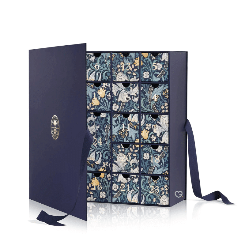 Neal's Yard Remedies Advent Calendar 2025 in blue festive box with 24 organic beauty treats including full-size skincare icons.