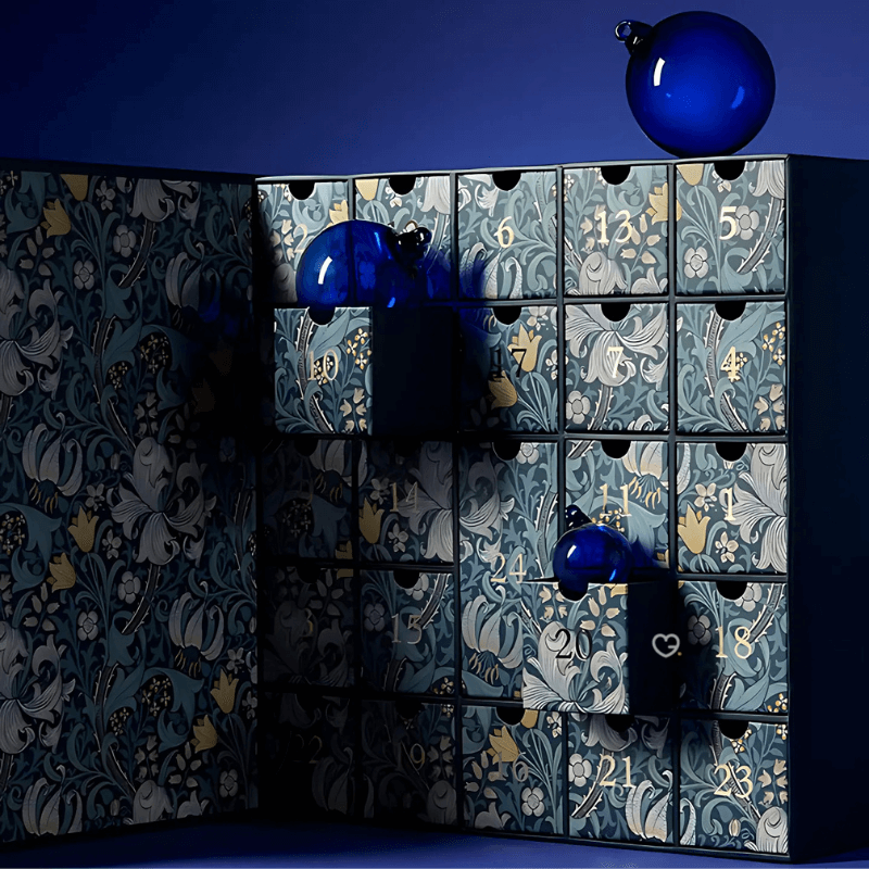 Neal's Yard Remedies Advent Calendar 2025 in blue festive box with 24 organic beauty treats including full-size skincare icons.