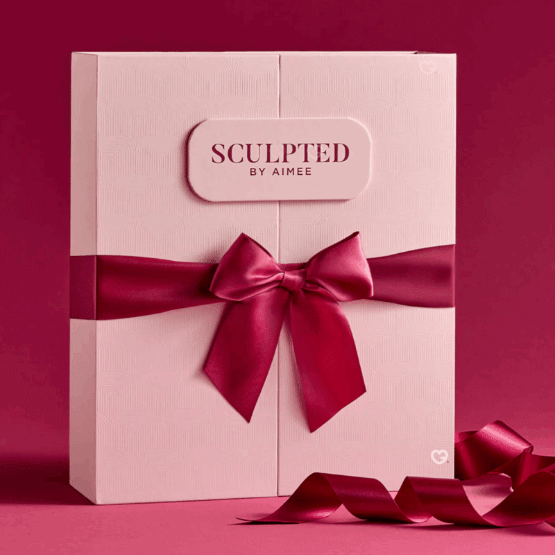 Sculpted By Aimee Advent Calendar 2025 with 12 beauty treats including 8 full-sized and 5 exclusive skincare and makeup products for women.