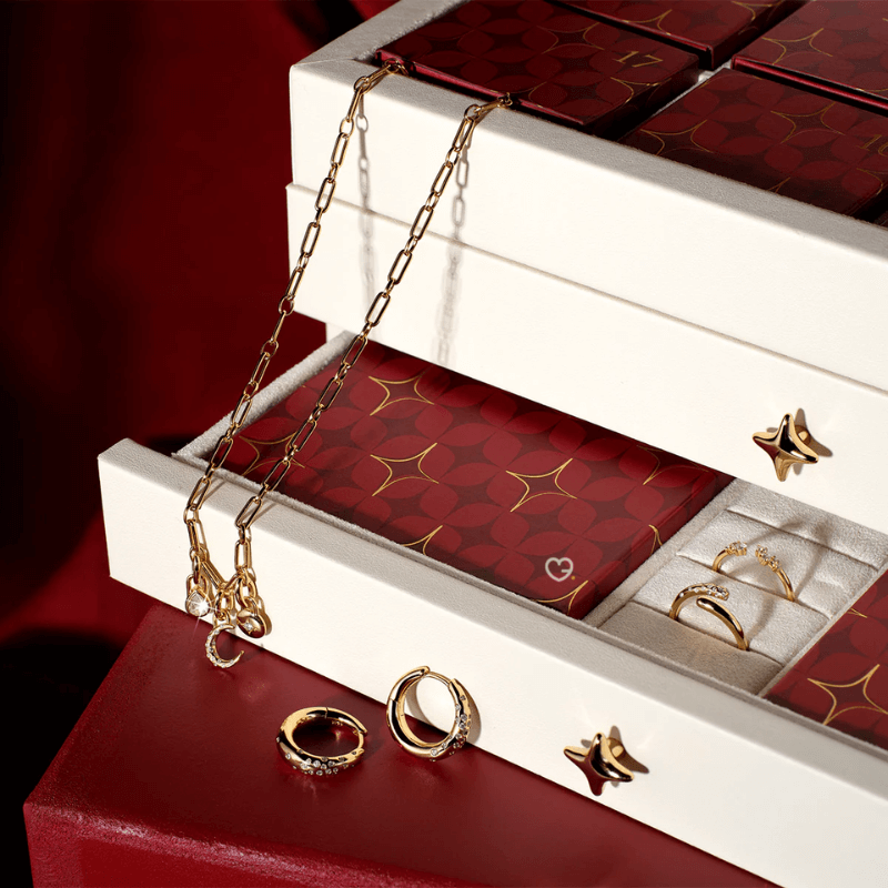 Astrid & Miyu - 24 day Advent Calendar 2025 in gold featuring 23 stackable jewellery pieces, crystal and dome styles, ideal for style-conscious women.