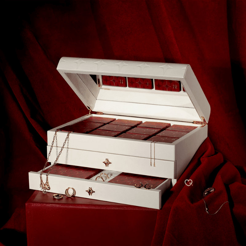 Astrid & Miyu - 24 day Advent Calendar 2025 in gold featuring 23 stackable jewellery pieces, crystal and dome styles, ideal for style-conscious women.