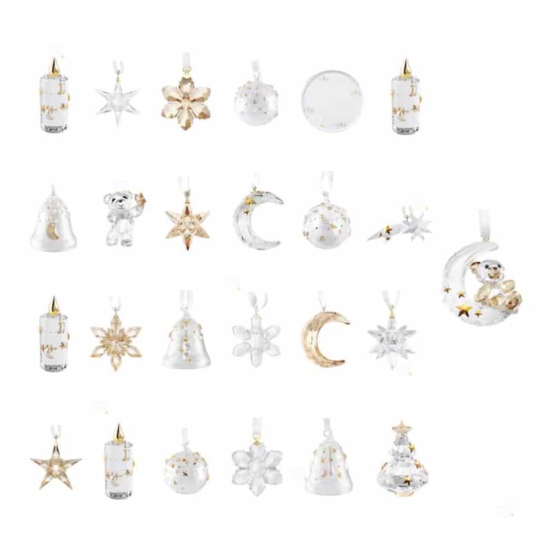 All 25 crystal ornaments of the Swarovski Advent Calendar 2026: candles, stars, snowflakes, moons, bells, an angel, a tree and the Kris Bear