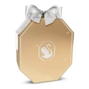 Swarovski Advent Calendar 2026, a luxury advent calendar in a champagne gold-tone octagonal box with a white bow, shown closed