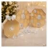 Swarovski Advent Calendar 2026 crystal advent calendar styled beside a lit Christmas tree, opened with crystal candles, the Kris Bear and ornaments displayed in front