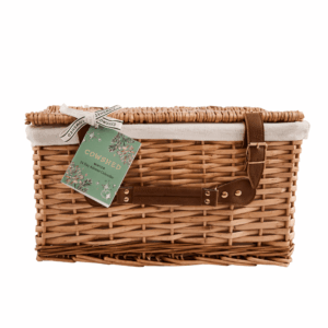 Cowshed Advent Calendar 2025 in a wicker hamper with 24 beauty treats from candles to lotions for festive self-care.