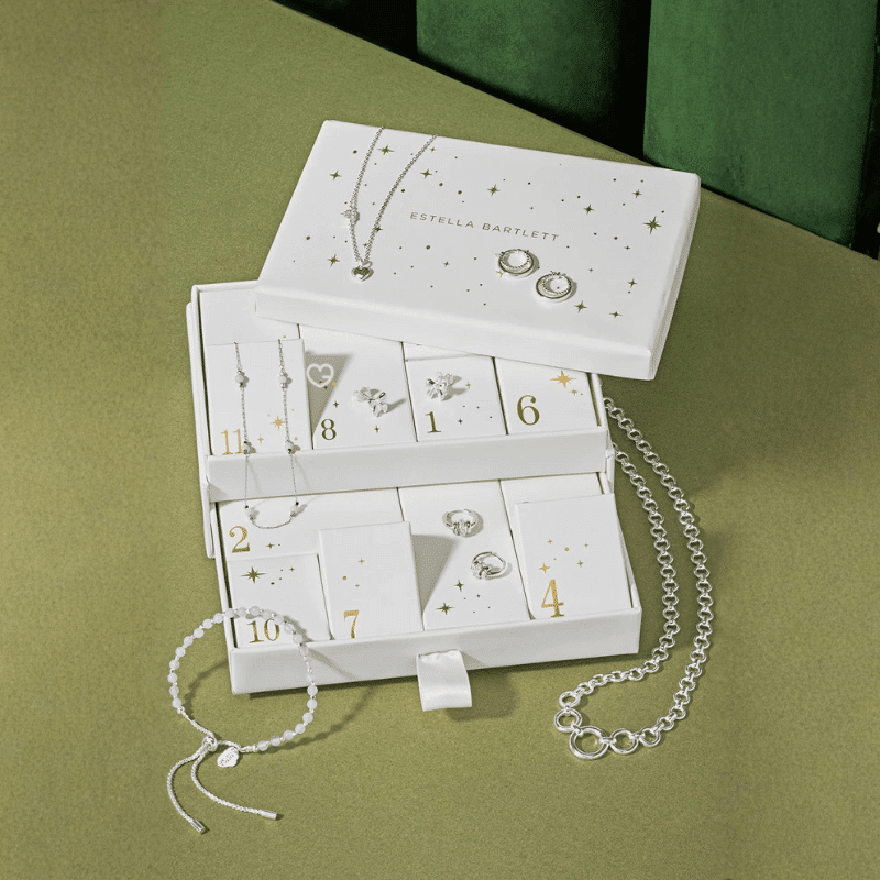 Estella Bartlett Advent Calendar 2025 with 12 gold- or silver-plated necklaces, bracelets and earrings in festive packaging for style-conscious women.
