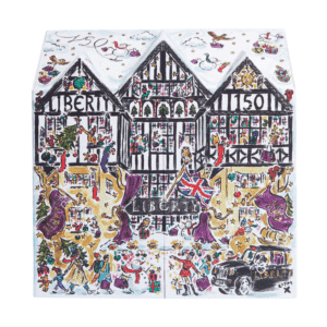Luxurious Liberty London Advent Calendar 2025, illustrated in the shape of the iconic Tudor storefront, featuring high-end skincare, makeup, and fragrance products from brands like Le Labo, Augustinus Bader, and Sisley.
