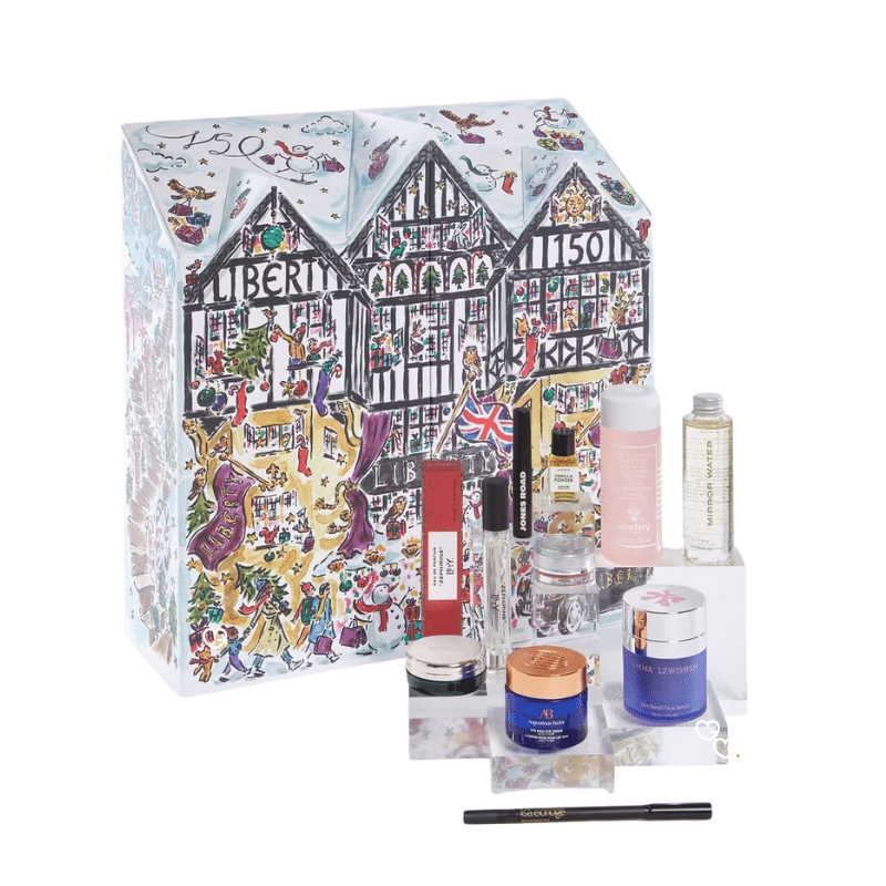 Luxurious Liberty London Beauty Advent Calendar 2025, illustrated in the shape of the iconic Tudor storefront, featuring high-end skincare, makeup, and fragrance products from brands like Le Labo, Augustinus Bader, and Sisley.