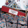 Liberty London Advent Calendar 2025, illustrated like the iconic Tudor storefront, with luxury skincare, makeup, and fragrance products displayed in front.