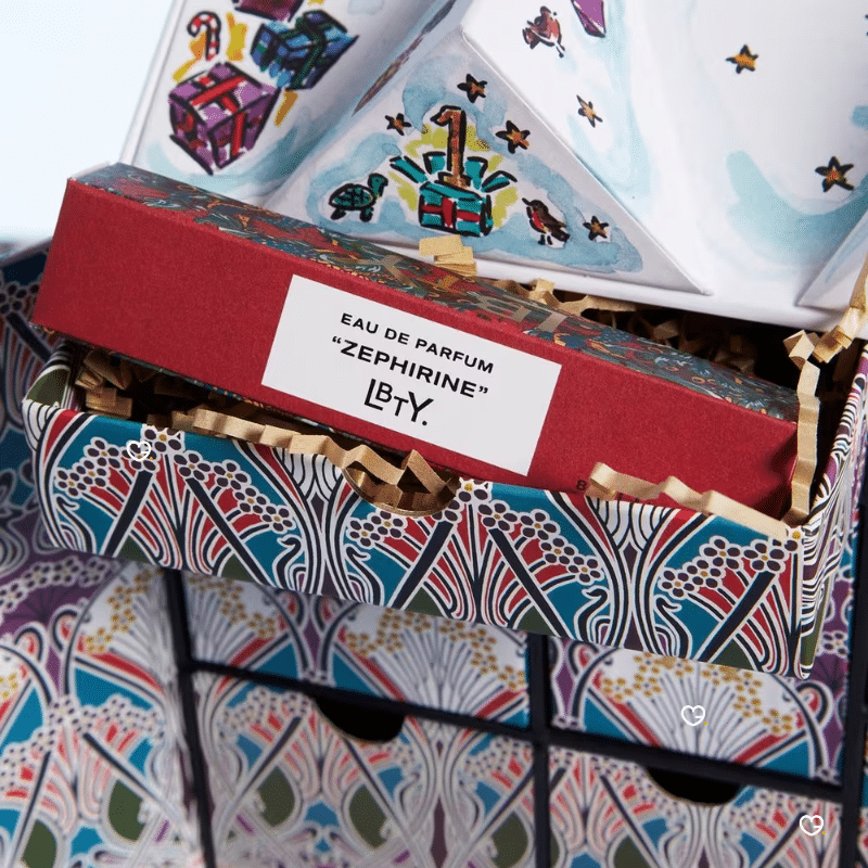 Liberty London Advent Calendar 2025, illustrated like the iconic Tudor storefront, with luxury skincare, makeup, and fragrance products displayed in front.