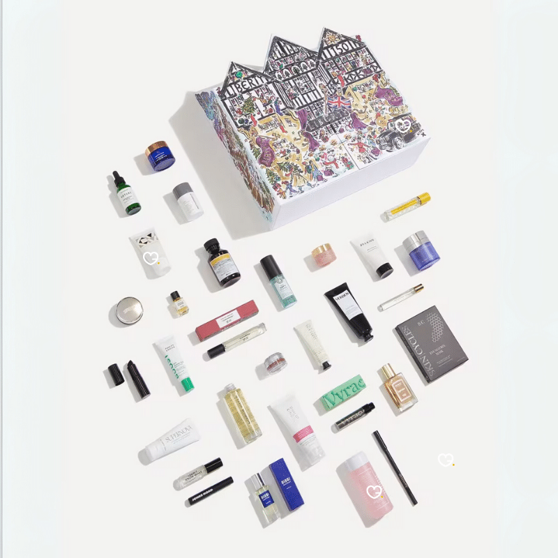 Liberty London Advent Calendar 2025, illustrated like the iconic Tudor storefront, with luxury skincare, makeup, and fragrance products displayed in front.
