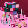 2025 benefit advent calendar filled with 24 beauty favorites like Bronzer, mascara, blush.. in a design box The Glam Cube