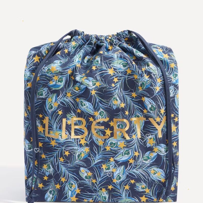 Liberty Print Festive Plume drawstring bag included with the 2026 Beauty Advent Calendar