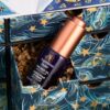 Close-up of a serum from the Liberty Beauty Advent Calendar 2026 on Liberty print interior