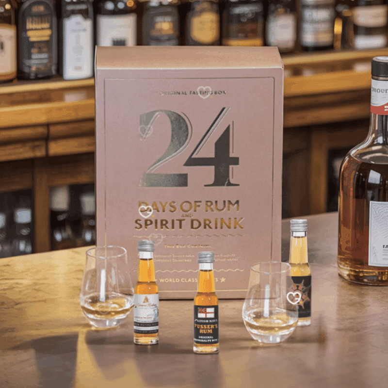 24 Days of Rum Advent Calendar 2025 with 24 rum miniatures, 2 tasting glasses and festive gift packaging.
