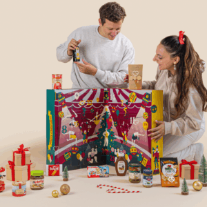 Degusta Box Advent Calendar 2025 with 24 full-sized sweet and savoury treats in a festive Christmas design.