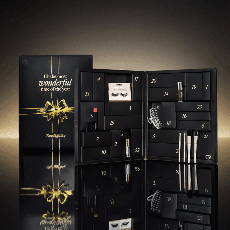 Prettylittlething Advent Calendar 2025 in pink festive box with 24 beauty treats including skincare, makeup and haircare.