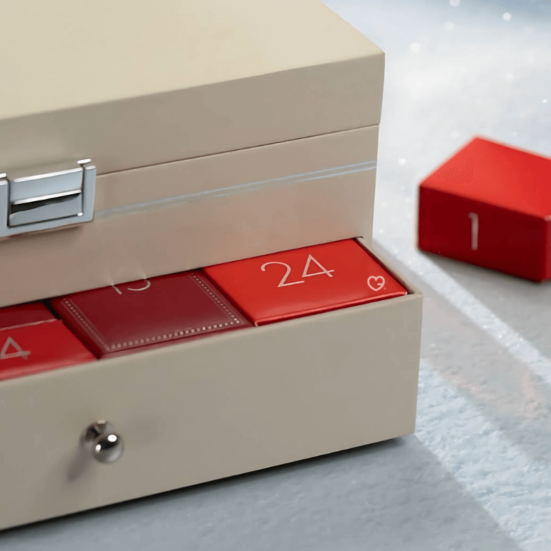 The Perfume shop Advent Calendar 2025 in a red festive box with 24 luxury mini perfumes and built‑in mirror.