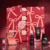 Glossybox beauty advent calendar 2026 product selection on burgundy background