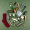 Vogue Festive Calendar 2026 full contents flatlay: 28 luxury full-size products including Otiumberg jewellery, La Mer and Longchamp