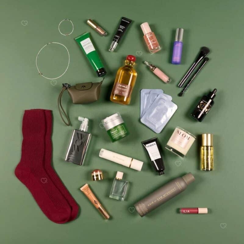 Vogue Festive Calendar 2026 full contents flatlay: 28 luxury full-size products including Otiumberg jewellery, La Mer and Longchamp