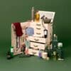Vogue Festive Calendar 2026 open travel trunk revealing luxury beauty products across 25 drawers