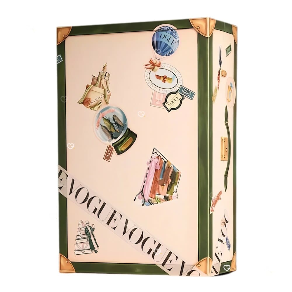 Vogue Festive Calendar 2026 travel trunk box, cream with forest green piping and gold corners, closed view