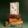 Vogue Festive Calendar 2026 trunk displayed on vintage travel cases with festive styling
