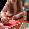 Legami Advent Calendar 2025 with 24 stationery surprises in a glittery reusable train-shaped box, perfect for creative adults.