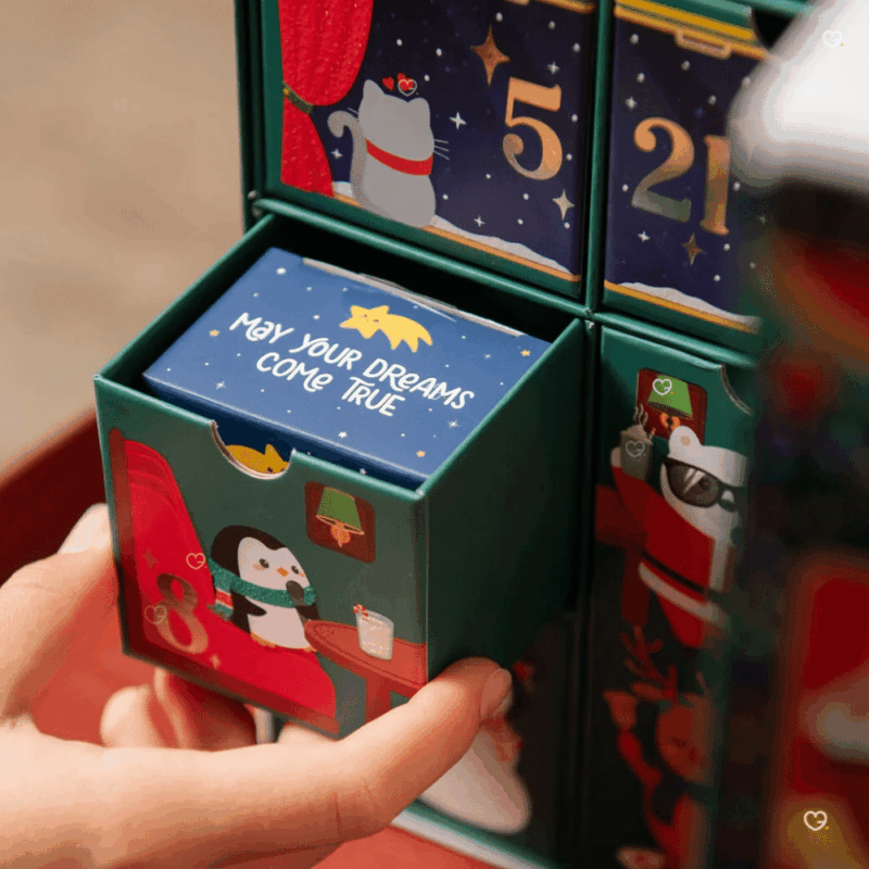 Legami Advent Calendar 2025 with 24 stationery surprises in a glittery reusable train-shaped box, perfect for creative adults.