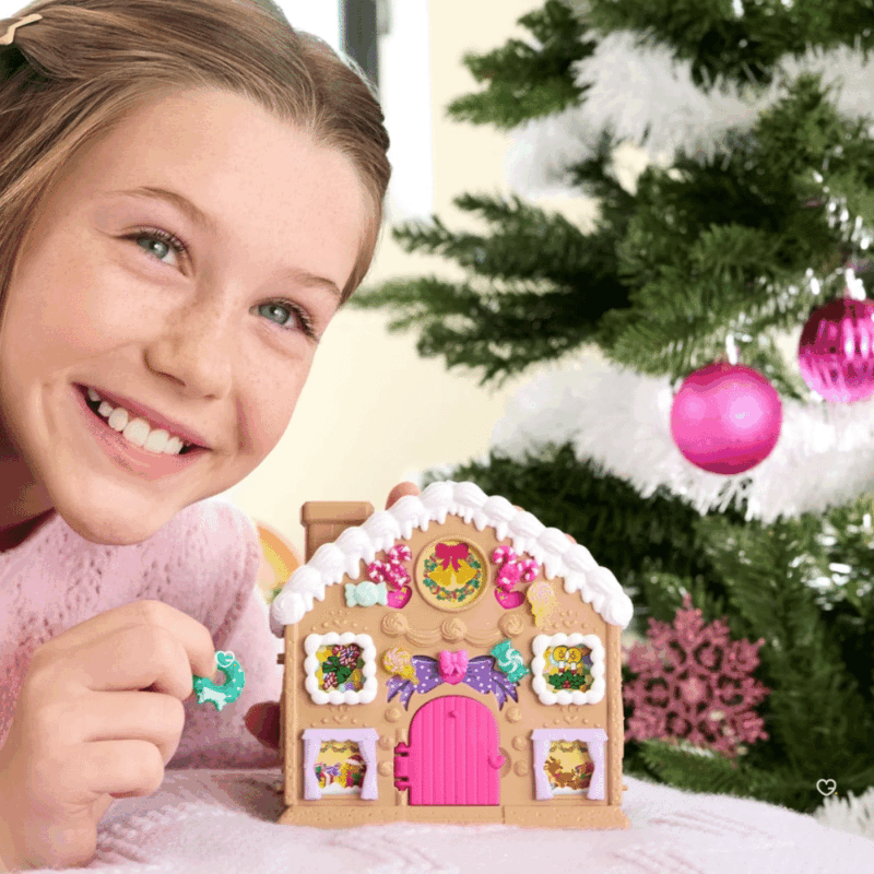 Polly Pocket Advent Calendar 2025 with 24 festive surprises, mini Polly figurine and gingerbread house playset for kids’ holiday fun.
