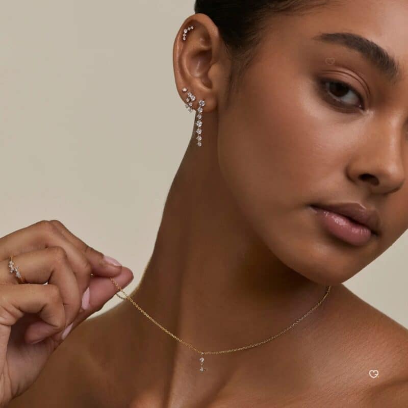 Model wearing gold jewellery from the Astrid & Miyu 2026 advent calendar