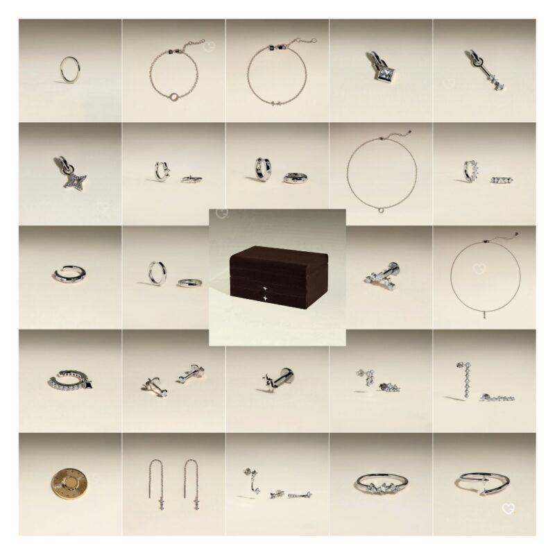 All 23 silver jewellery pieces from the Astrid & Miyu 2026 advent calendar laid out with the box